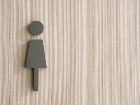 the female icon on vertical pattern backgroundの写真素材