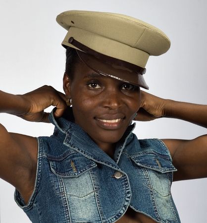 Sexy african American girl, in her twenties, no makeup, smiling, isolated on gray backgroundの写真素材