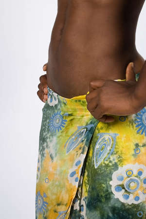 Young african woman, tummy, color skirt, health seriesの写真素材