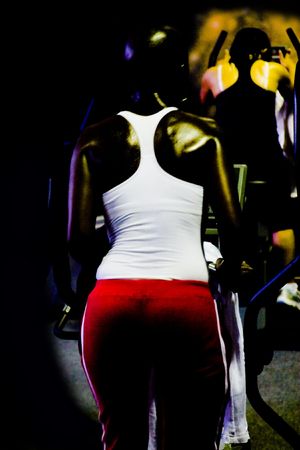 Low key posterised image, I am sweaty, my mind is empty, muscles are working by their own will, just me and the machine, の写真素材