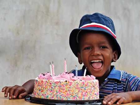 African American child with the birthday cakeの写真素材