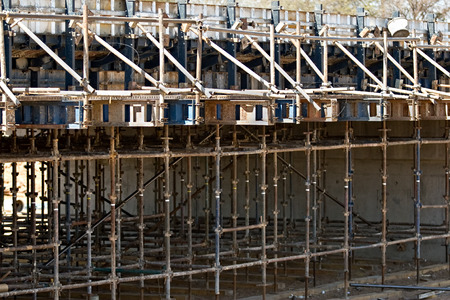 Scaffolding bridge construction, over a small river, architecture series