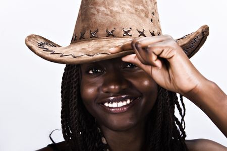 Young African woman smiling, with cowboy hat and dreadlocks hairstyleの写真素材