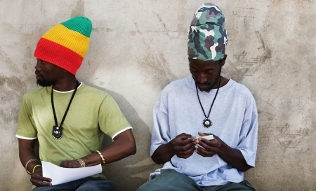 Rastafarian men smoking cannabisの写真素材