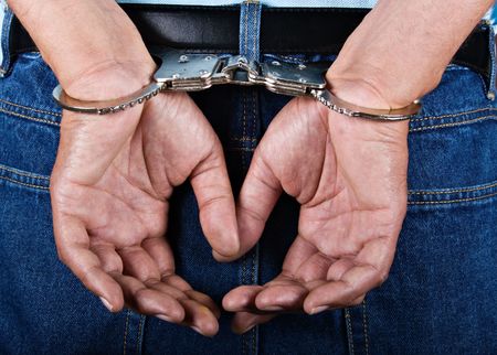 Man handcuffed hands at the back 