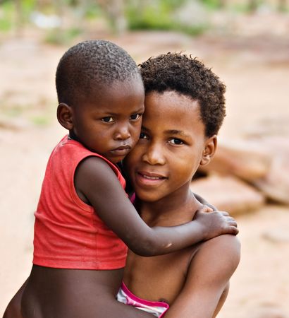 African children brother and sister, social issues, poverty, village near Kalahari desertの写真素材