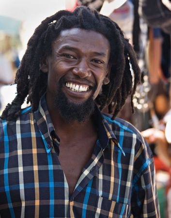 portrait of young rasta man in the flea marketの写真素材