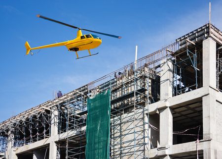 Helicopter on site visiting the construction stageの写真素材