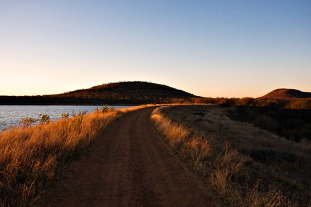 african sunset by the lake, in Mokolodi  game reserve in Botswana.の写真素材