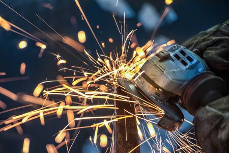 Sparks from an African man grinding metalの写真素材