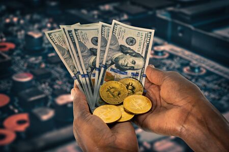 African woman hands holding a stack of bitcoins and dollars,