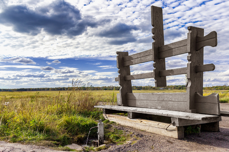 A bench with a spring in the fieldの写真素材