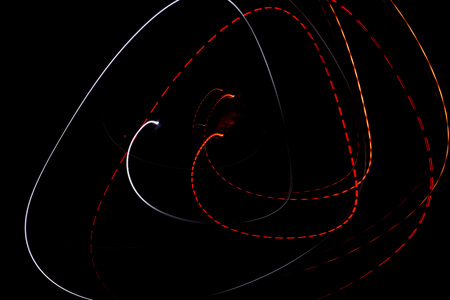Lights shot on long exposure on a black backgroundの写真素材