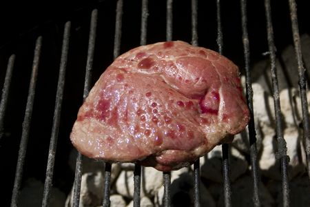 a raw steak on the grillの写真素材
