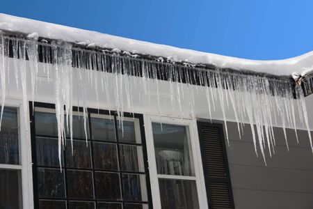 icicles hanging from a rooftop