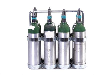 a case of 8 oxygen tanks isolated on whiteの写真素材