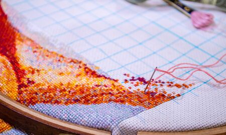 hoops for embroidery with a neat cloth and threads lying behindの写真素材