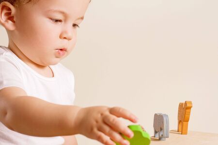 small boy playing with his colorful toysの写真素材