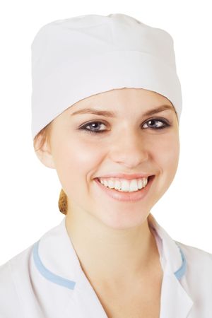 Smiling beautiful young nurse in white capの写真素材