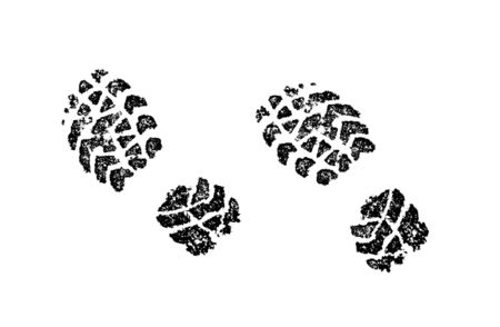 Black boots footprints on white snow close-up