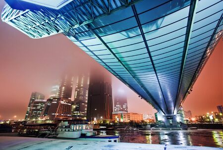 Long blue bridge over a river in the eveningの写真素材