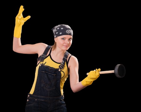 Young woman in yellow gloves with air-corkの写真素材