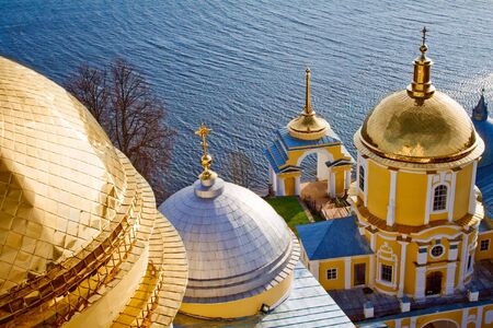 Old orthodox church near blue waterの写真素材