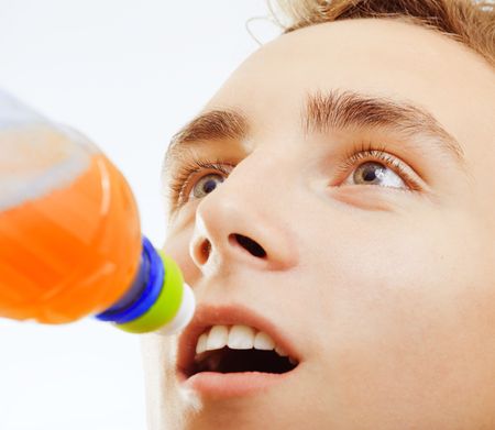 Young man drinking from a bottleの写真素材