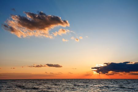 Sunset with clouds on the seaの写真素材