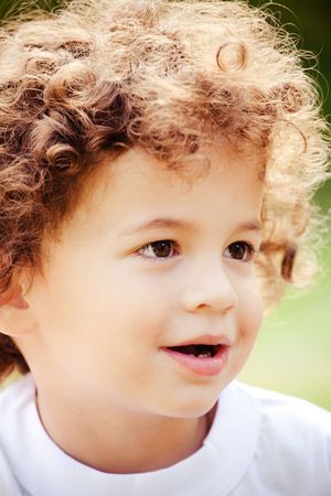 Young boy with curly hair portraitの写真素材