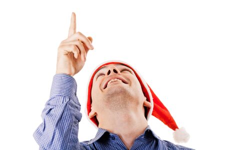 Young man in Santa hat looking upの写真素材