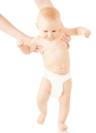 Small baby is walking on white backgroundの写真素材