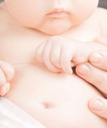 Small baby is walking on white backgroundの写真素材