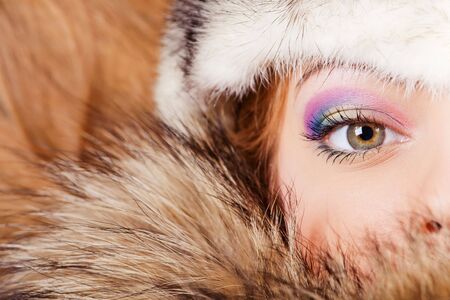 Woman in fur hat face closeupの写真素材