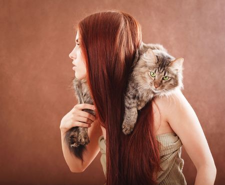 Young pretty girl holding a ctの写真素材