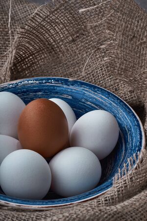Ecological natural fresh eggs collected in the plate for cookingの写真素材