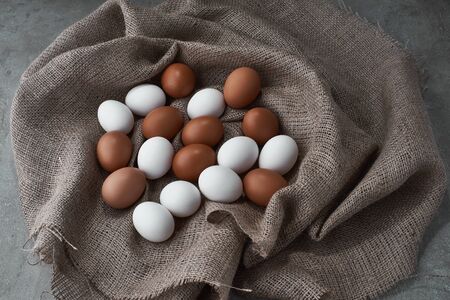 Fresh chicken eggs in a bag on a farm.