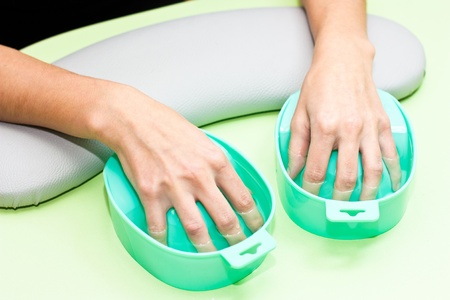 The process of steaming hands before manicureの写真素材