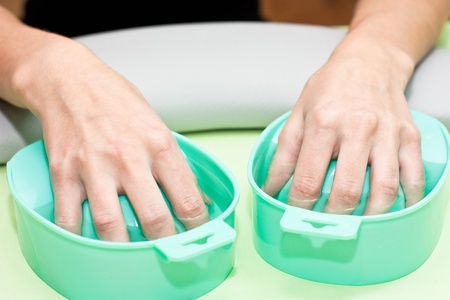 The process of steaming hands before manicureの写真素材