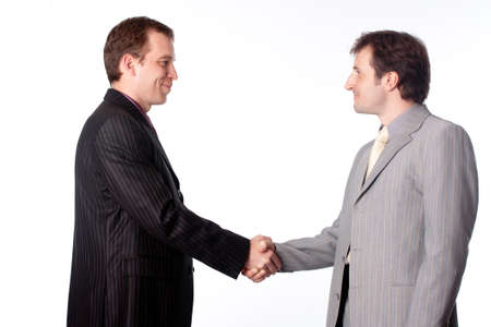 	Close up of businessmen shaking handsの写真素材