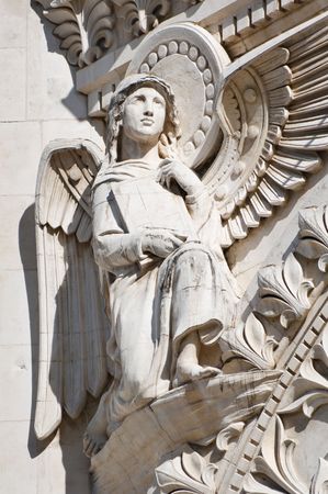 Beautiful Angel Sculpture with Wings and Holy Bible.の写真素材