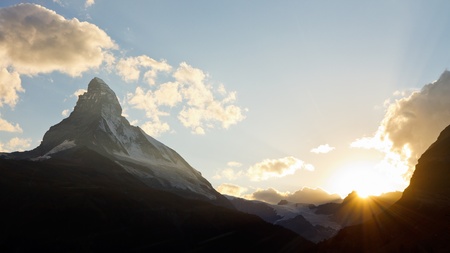 Matterhorn at sunset. The sun is setting behind Switzerland's most iconic mountain.の写真素材
