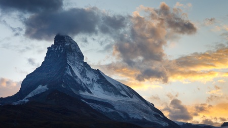 Matterhorn at dusk. The sun has just set behind Switzerland's most iconic mountain.の写真素材