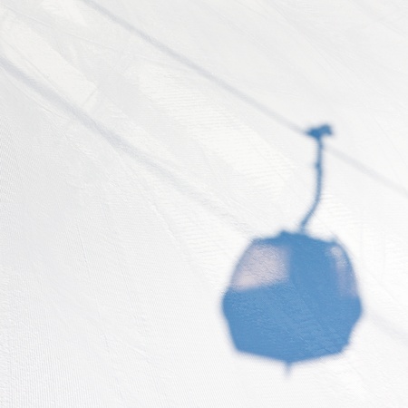 Shadow of a gondola ski lift in South Tyrol, Italy の写真素材