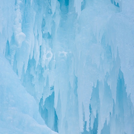 Icicles at a frozen waterfall in the Alps, South Tyrol, Italy.