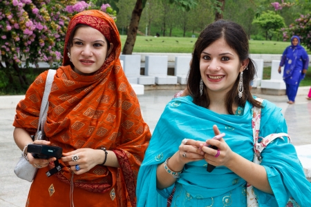 ISLAMABAD - JULY 16: Two unidentified Pakistani women at the Faisal Mosque on July 16, 2011 in Islamabad. The Faisal Mosque is the largest mosque in Pakistan and one of the largest ones in the world.のeditorial素材