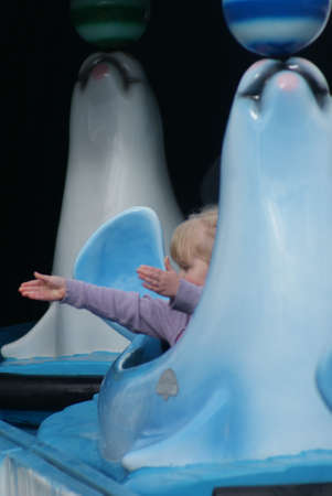 Child enjoying rides at Funfairの写真素材
