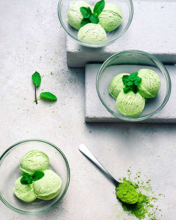 Matcha Ice Cream with Mint Leaf in bright grey backgroundの写真素材