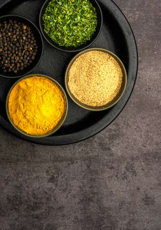 High quality close up photo of various spices with a dramatic concept.