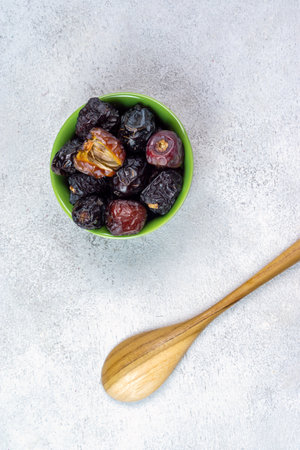 Raw Organic Arabic Dates, Ajwa Dates on light gray background. Ramadan Kareem. Top View.の写真素材